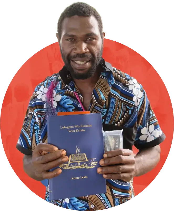 pacific man holding new Scripture