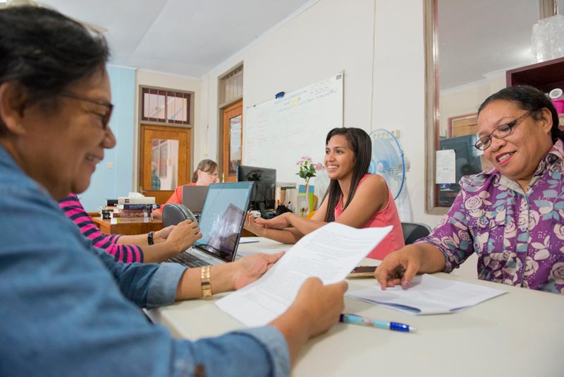 Women from the Ambonese Malay Bible translation team helping check translated passages.