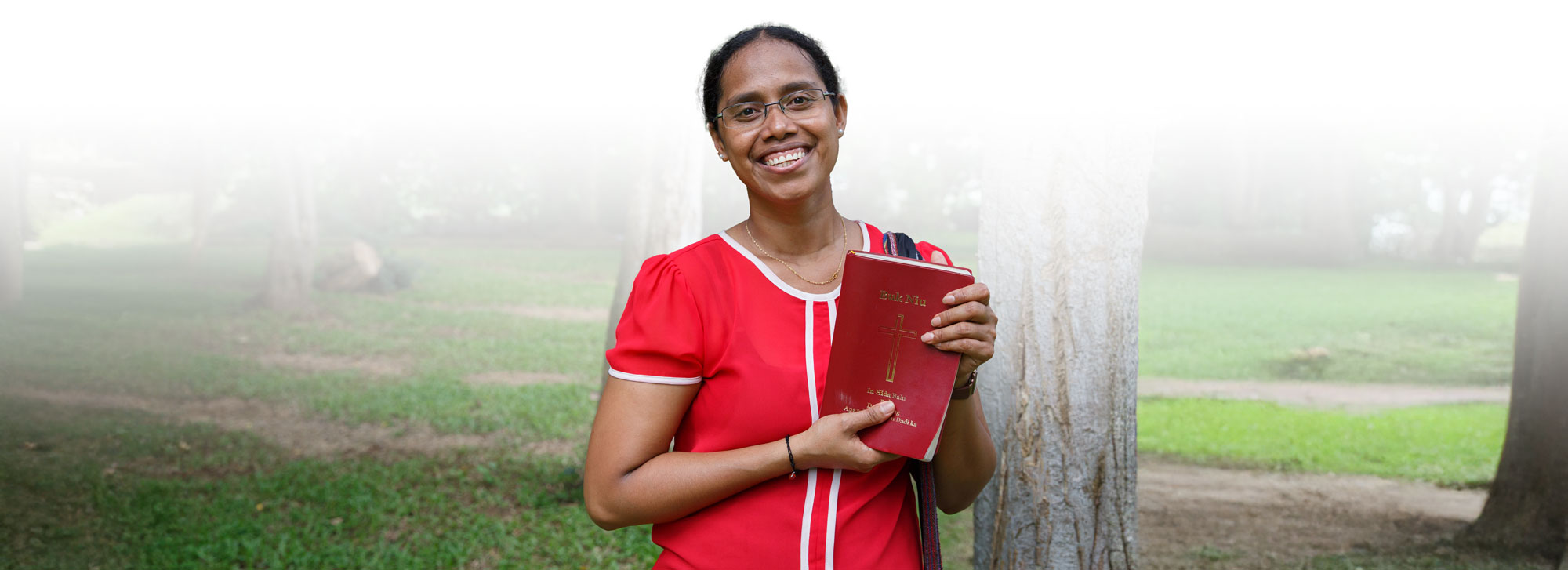 Thai woman holds bible