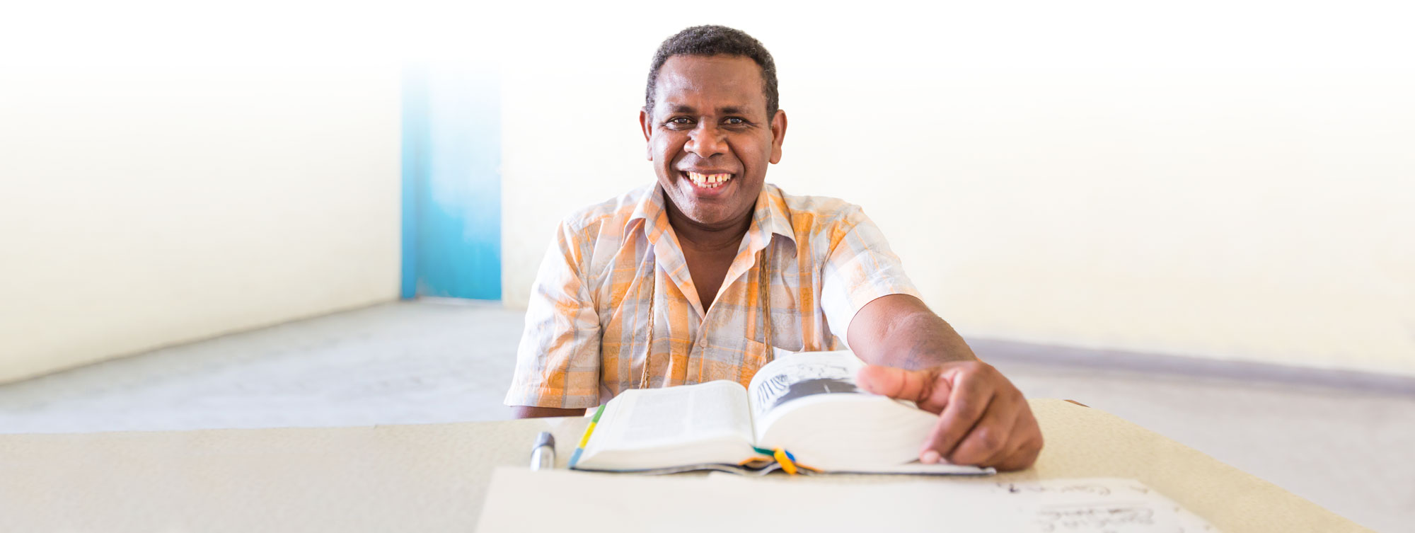 Man with Bible seated