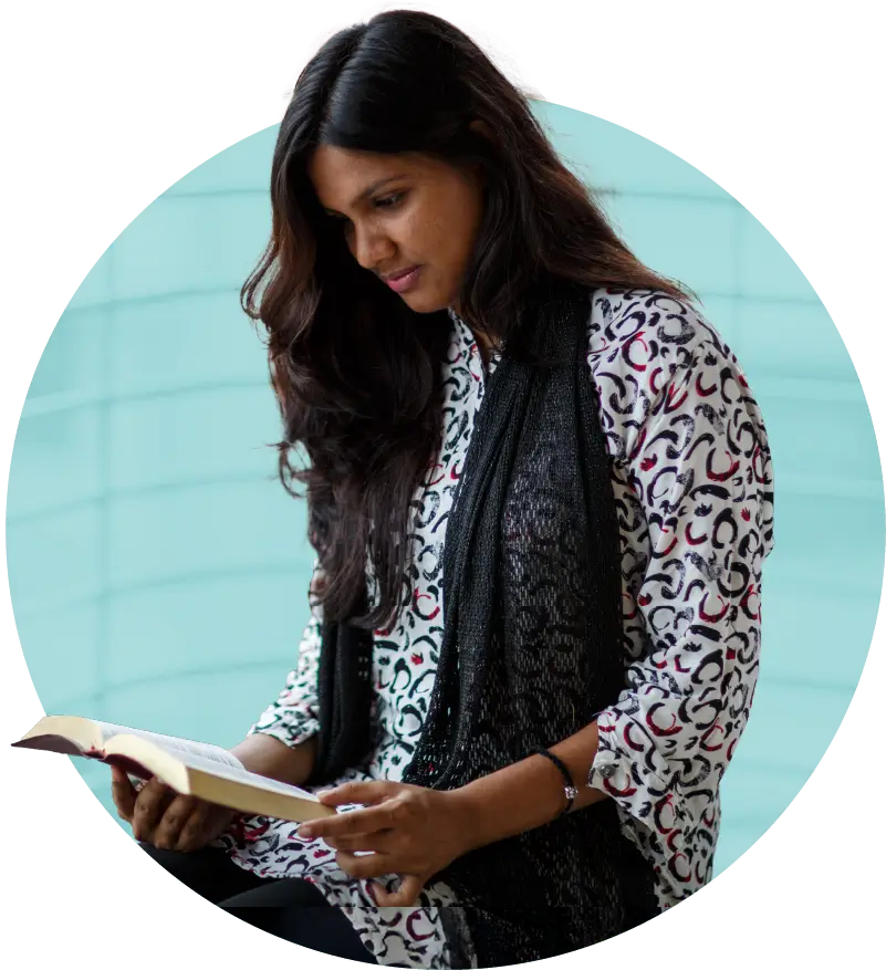 woman looking down at her bible